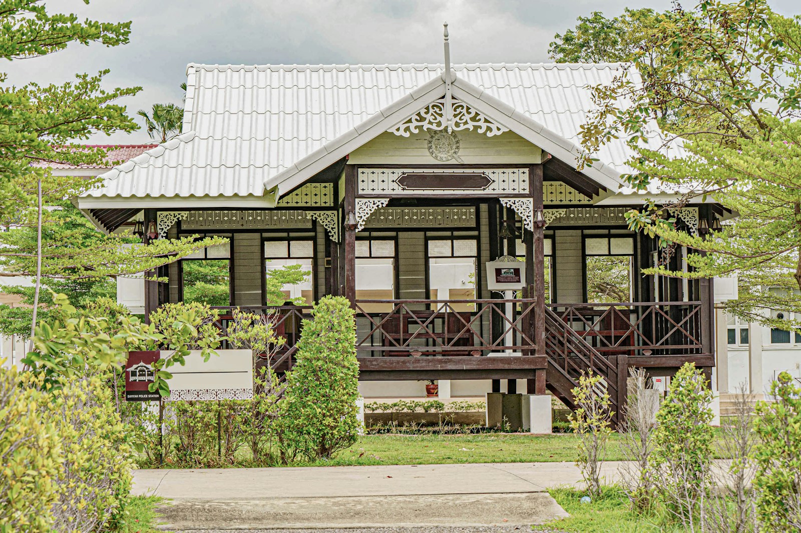 a house with a white roof and a porch with homeowners insurance